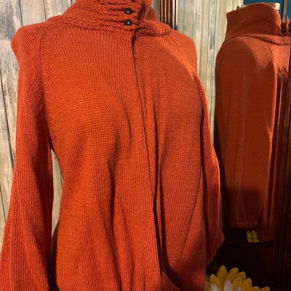 Warm and cozy sweater with high neck.